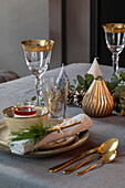 Festive table setting with golden accents