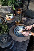 Rustic outdoor coffee table with cake and drinks