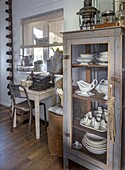 Vintage desk with typewriter and crockery cupboard