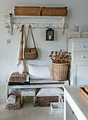 Wardrobe with white bench, wall shelf and wickerwork