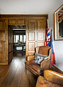 Corner with leather armchairs and flags