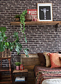 Industrial bedroom with brick wall and wooden elements