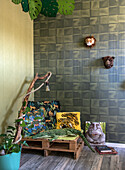 Corner in children's room with jungle theme and wooden pallet bench seat