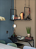 Small workspace with retro typewriter and hanging shelf