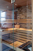 View of modern sauna with glass wall