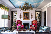 William and Mary-style velvet armchair in front of a trompe-l'œil sky in a London living room