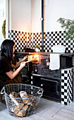 Traditional wood-burning stove with black and white tiles in the kitchen