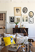 Living room with antique cabinet and picture wall in black and white