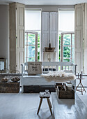 Bright living room with antique wooden windows and rustic decoration