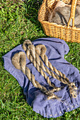 Braided flax on linen cloth in the garden