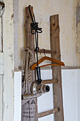 Rustic clothes ladder with hairdryer and clothes hanger in the bathroom