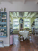 Country-style kitchen with rustic furniture and terracotta tiles