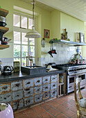 Country-style kitchen with rustic base unit and gas oven