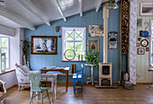 Country-style room with wood stove and blue wall