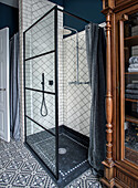 Loft-style shower cubicle with retro tiles and dark shower curtain