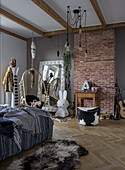 Bedroom with hanging chair, brick floor and herringbone parquet flooring