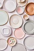 Crockery in pastel colors and sugar eggs for Easter