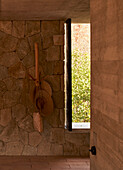 Natural stone wall and wooden elements in the hall area, Mexico