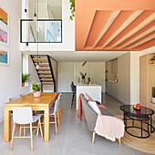 Modernes Einfamilienhaus mit offener Küche und korallenfarbenen Deckenbalken