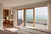 Bedroom with views of the beach and sea