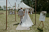 Bridal couple on their way to the ceremony tent