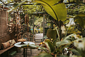 Seating area in the lushly planted greenhouse