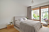 Bright bedroom with balcony access