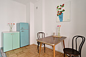 Retro kitchen with turquoise fridge and dining area