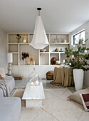 Living room with white shelves and Christmas decorations