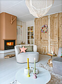 Living room with fireplace, wooden cabinet and modern decoration