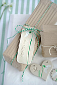 Wrapped gifts with personalised clay tags