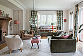 Living room with patterned curtains and brick fireplace