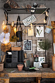 Workbench with decorative wall grid and garden utensils