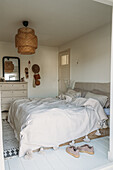 Bedroom in natural colours and boho decorations