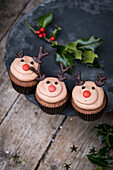Christmas reindeer cupcakes with chocolate antlers and red nose