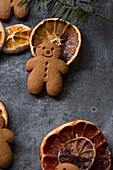 Gingerbread man with dried orange slices on a tray
