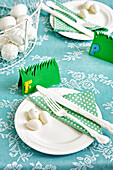 Easter table setting with green name cards and dotted napkins