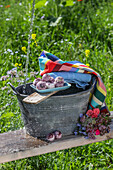 Summer garden scene with zinc tub, towel and bath balls