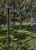 Washing line with towel under the apple tree in the garden