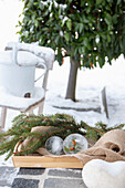 Christmas ice decoration with fir branches in the winter garden