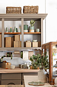 Cupboard with ceramic crockery and Christmas decorations