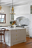 Modern country kitchen with tiled splashback and golden elements