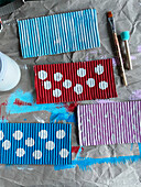 Crafting colorful pointed hats from corrugated cardboard as pendants