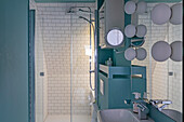 Bathroom with blue walls and white metro tiles