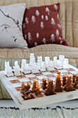 Marble chessboard on glass coffee table in the living room