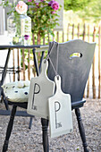 DIY ping pong racket made from kitchen boards in the garden