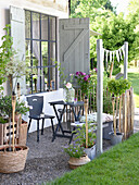 Cosy terrace with self-made shutters and bamboo torches