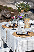 Outdoor garden table with chequered tablecloth and rattan elements