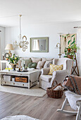 Inviting living room with cream-coloured upholstered furniture and floral accents