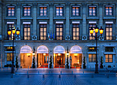 Facade and entrance of the Hotel Ritz in the evening, Paris, France